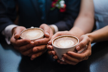 Latte. The lovers drink coffee. Coffee mugs.