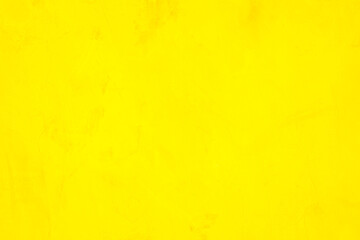 Concrete wall yellow color for texture background. Abstract grunge bright colorful color background with colored low contrast textured with roughness and irregularities.