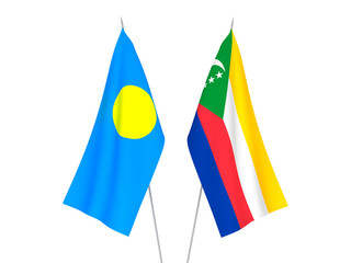 National fabric flags of Palau and Union of the Comoros isolated on white background. 3d rendering illustration.