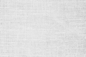 White fabric jute hessian sackcloth canvas woven gauze texture pattern in light white color blank. 