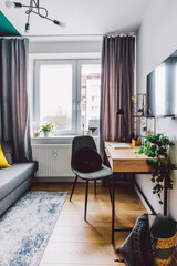 Interior of small apartment living room for home office.