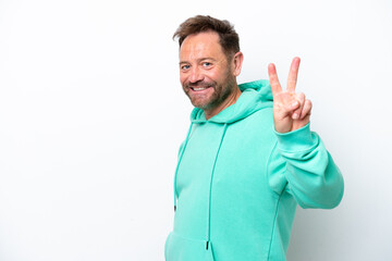 Middle age caucasian man isolated on white background smiling and showing victory sign
