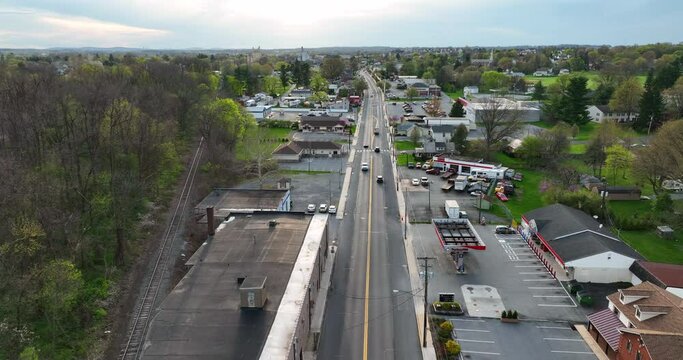 Street Through Small Town In America. Spring Season With Rural Poor Community. Reverse Dolly Aerial.