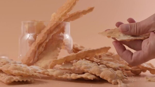 CHIACCHIERE. homemade traditional carnival sweets. Traditional sweet crisp pastry deep-fried and sprinkled with powdered sugar. Italian carnival food tradition