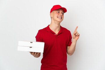 Pizza delivery man with work uniform picking up pizza boxes isolated on white background pointing up a great idea