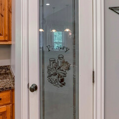 Square Pantry door with ornate glass panel with pantry signage