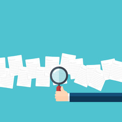 Employer with magnifying glass exploring documents