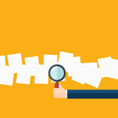 Employer with magnifying glass exploring documents