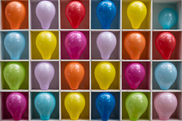 Cells with colorful bright balloons for a children's party. Multi-colored balloons as targets.