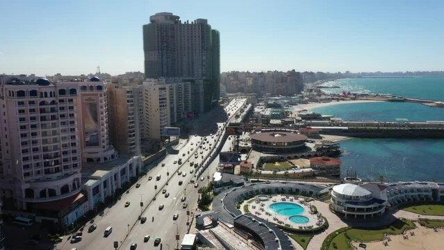 Side Panning shot of Alexandria Corniche and traffic at noon (Alexandria, Egypt)
