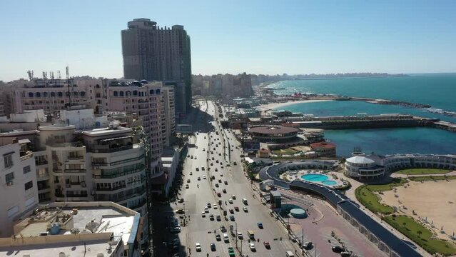 Side Panning Reveal shot of Alexandria Corniche and Traffic (Alexandria, Egypt)