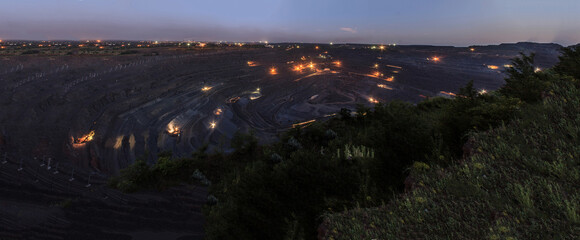 Iron ore open pit mining in Krivoy Rog quarries day and night