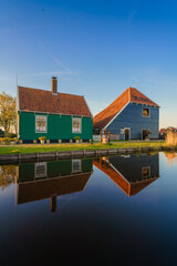Historical buildings and windmills at dawn in Zaanse Schans, Netherlands