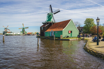 Fototapeta na wymiar Historical buildings and windmills at dawn in Zaanse Schans, Netherlands