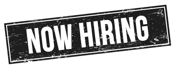 Fototapeta premium NOW HIRING text on black grungy rectangle stamp.
