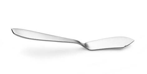 Knife spreads butter and jam on white background.