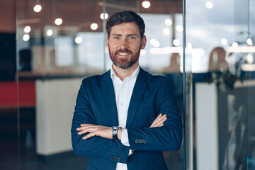 Portrait of a businessman while working in a modern office. Business and success concept