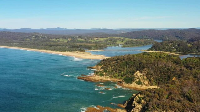 Rugged eroded rocky Sapphire coast of Australia at Bega river delta in 4k.
