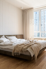 bedroom in white and beige tones, bedroom interior in loft style