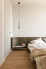 bedroom in white and beige tones, bedroom interior in loft style