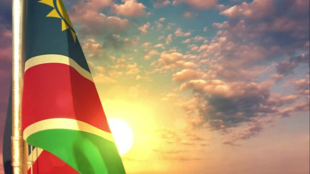 Namibia waving flag on beautiful sundown bg