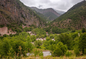 Fototapeta na wymiar Winding, narrow road through mountain gorge, summer, Greece