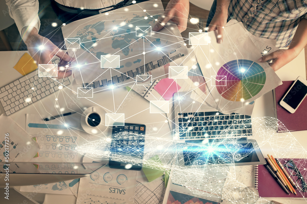 Poster double exposure of man and woman working together and the envelop hologram drawing. computer backgro