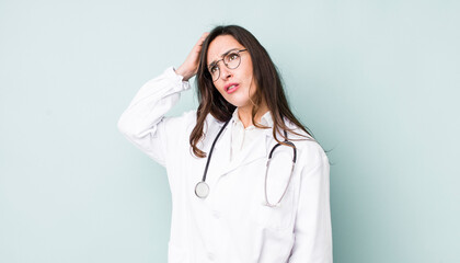 young pretty woman  feeling puzzled and confused, scratching head. physician concept