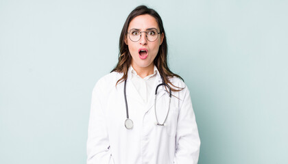 young pretty woman  looking very shocked or surprised. physician concept