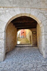 Fototapeta premium A narrow street in Sepino, a small village in Molise region, Italy.