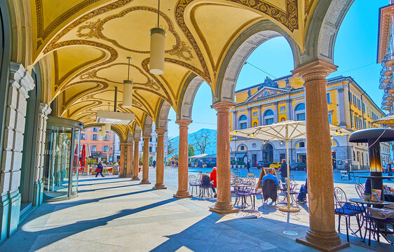 Piazza Riforma and Town Hall through the columns of arcade, Lugano, Switzerland