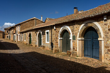 Street of Castrillo de los Polvazares village with the typical houses, Astorga, Leon, Spain.