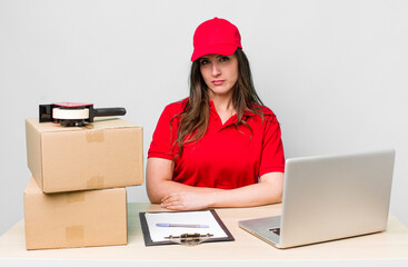 young pretty woman  feeling sad, upset or angry and looking to the side. company packer employee