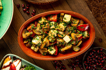 Caucasian cooked mushrooms with garlic and tomatoes