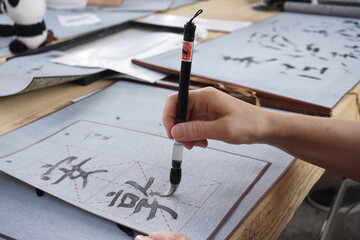 Shodo Japanese calligraphy brush writing process learning, study of hieroglyphs - obrazy, fototapety, plakaty