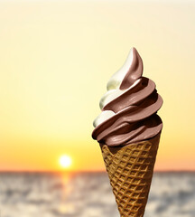 setting sun over the sea and an ice cream cone in the foreground

