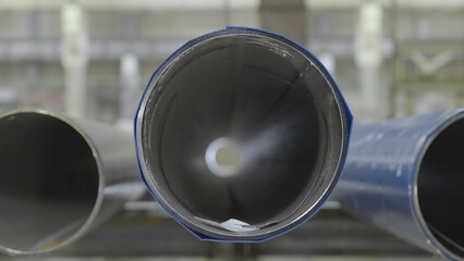 New industrial metal sewer pipes front view, close up. Pipe front view