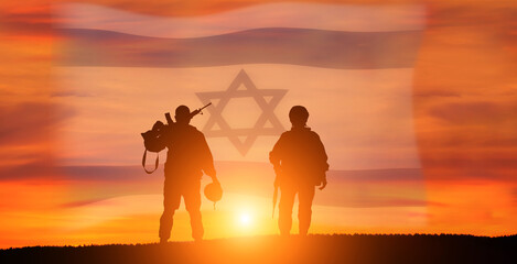 Fototapeta na wymiar Silhouette of Soldier in sunset background . Flag of Israel. National holiday .