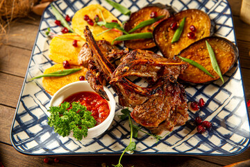 Closeup on lamb entrecote with eggplant and sauce