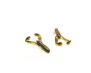 Two plastic crawfish or crawdad lures in watermelon with red flake color for flipping and pitching...