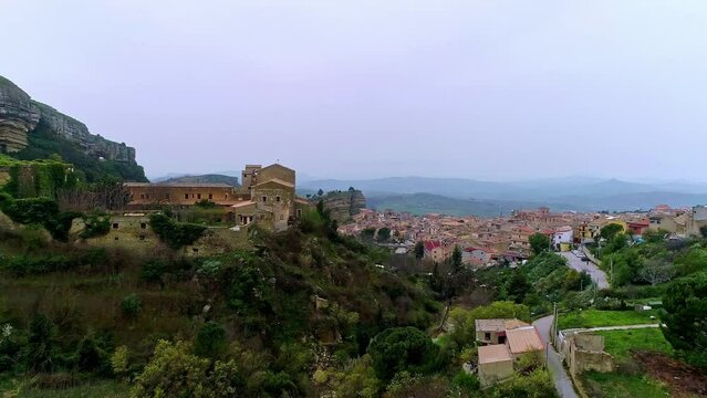 Aerial flight over Chiesa Maria SS del Malpasso and cityscape on Sicily during cloudy day