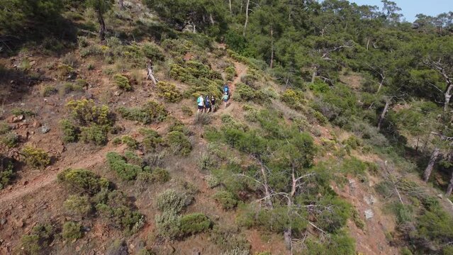 Hikers climbing uphill with backpacks. Lycian Trail. High quality 4k footage