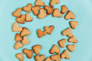 Homemade heart shaped cookies for Valentines day. Top view. Blue background