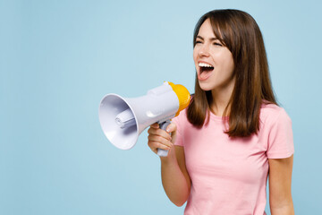 Young caucasian woman 20s wear pink t-shirt hold scream shout in megaphone announces discounts sale...