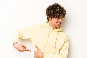 Young caucasian man isolated on white background having a liver pain, stomach ache.