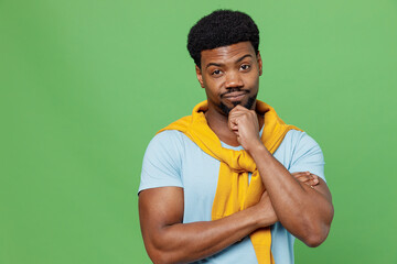 Young knowing truth shrewd fun man of African American ethnicity 20s wearing blue t-shirt look...