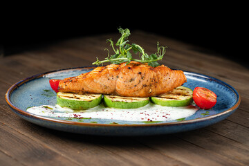 Grilled salmon steak with zucchini and creamy sauce