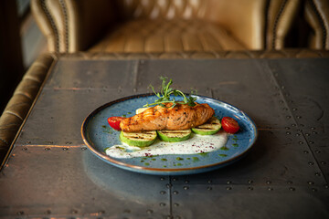 Grilled salmon steak with zucchini and creamy sauce