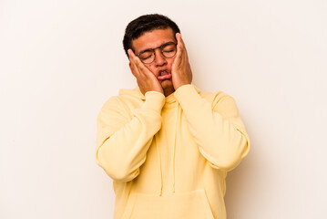 Young hispanic man isolated on white background whining and crying disconsolately.