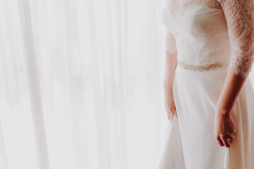 Detail of an elegant white wedding dress, with blank space for designs, copy space.